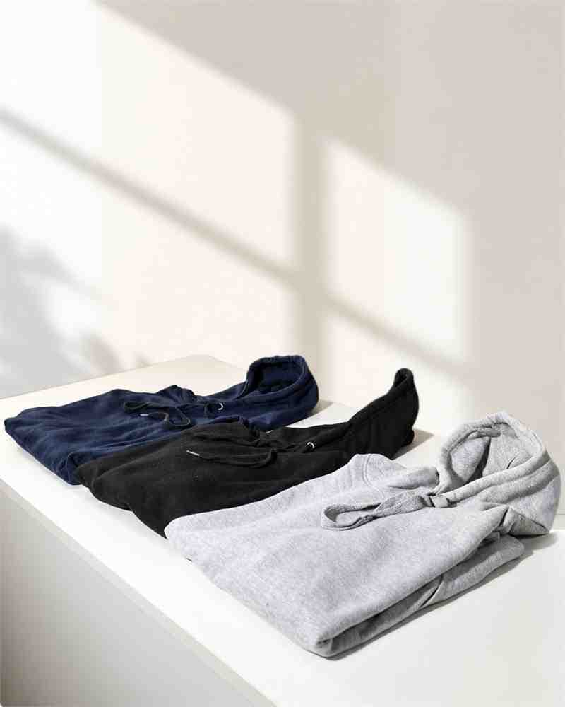 Neutral hoodies arranged in the Standex studio
