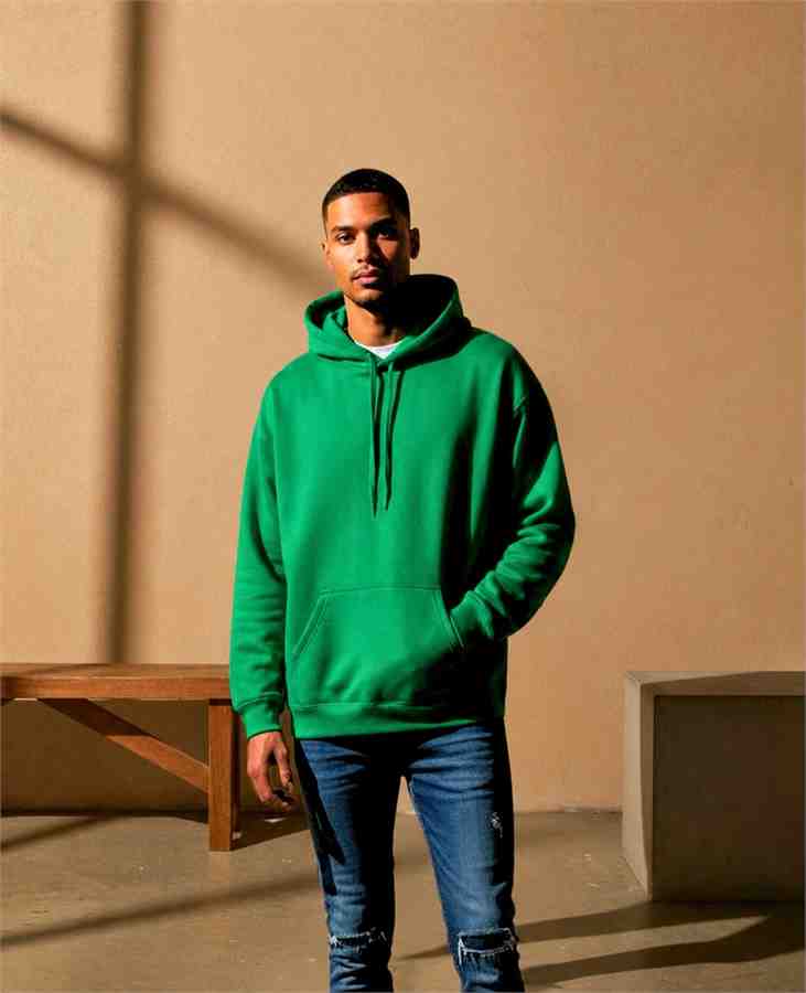 Model in warehouse green hoodie